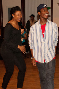 Ensemble member Alana Arena laughing with Young Adult Council member Malcolm London