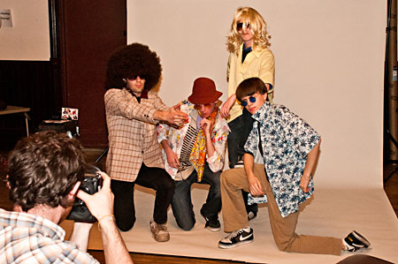 Students get their photo snapped in the 1970s dress-up photo booth