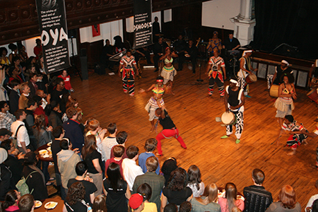 African dance group Muntu performs, bringing up teens to dance alongside them.