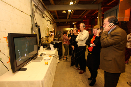 Guests listen in on the stage managers cue call of the opening storm sequence from Steppenwolf’s 2009 production of <em>The Tempest</em>. 
