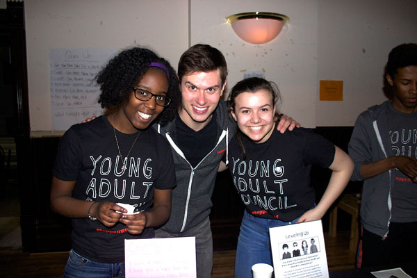 JJ Phillips (Zander from <em>Leveling Up</em>) poses with Young Adult Council members Nia Robinson and Molly McGaan.