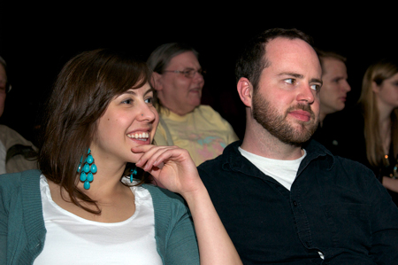 Event attendees watch the performances.