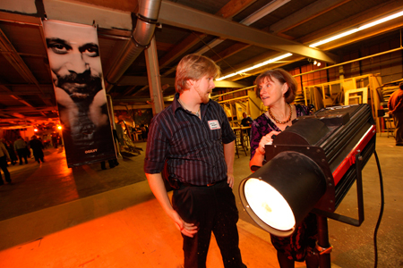 Volunteer Justin Argenio teaches Maggie Bobbitt how to operate a follow spot. 