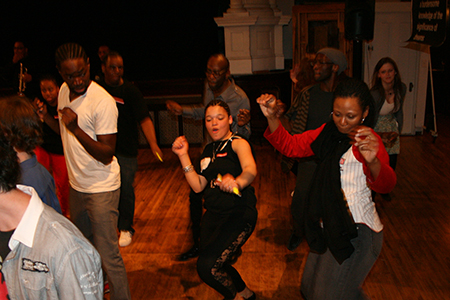 Playwright Tarell Alvin McCraney, Phillip James Brannon (Oshoosi) and ensemble members K. Todd Freeman (Ogun) and Alana Arena (Oya) dance with Young Adult Council member Brittany Stokes.