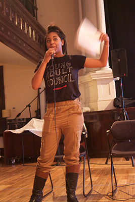 YAC member Charlotte Jackson performs a spoken-word poem as part of the event