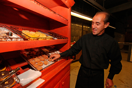 Homemade donuts made by Limelight Catering are served alongside the prop donuts from Steppenwolf’s 2008 production of <em>Superior Donuts</em>.
