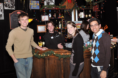 DePaul students Stephen Carmody (far L) and Williams Wever (far R), who designed Merle’s Place, enjoying the event.