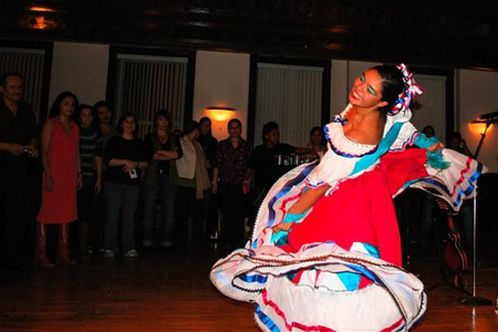 Young Adult Council member Viviani Valadez performs a traditional Mexican folkloric dance for the crowd.