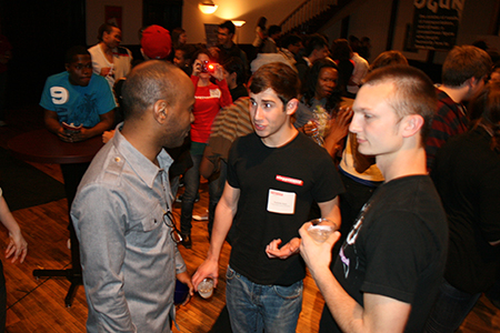 Young Adult Council member Andrew Raia chats with ensemble member K. Todd Freeman (Ogun).